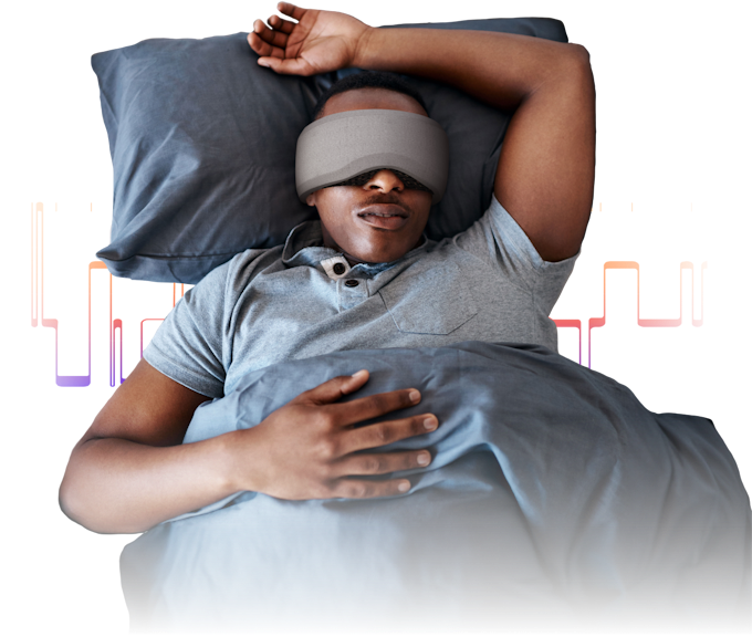 Man sleeping wearing Bía sleep mask